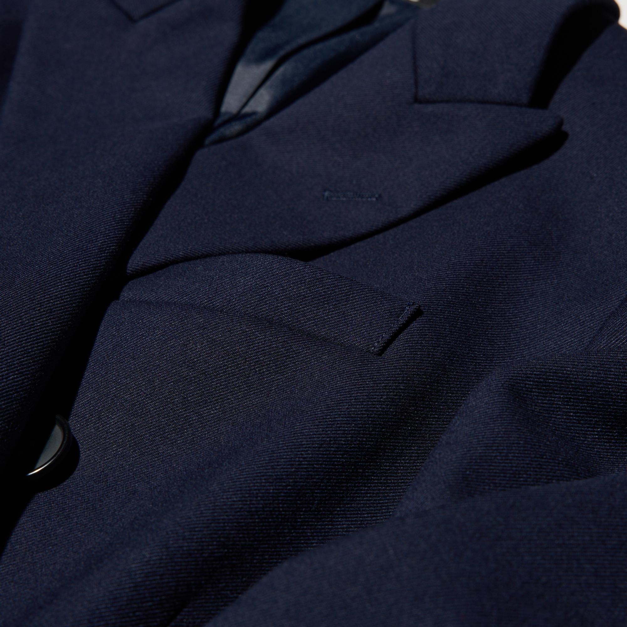 Double breasted design and fabric with a tailored look.