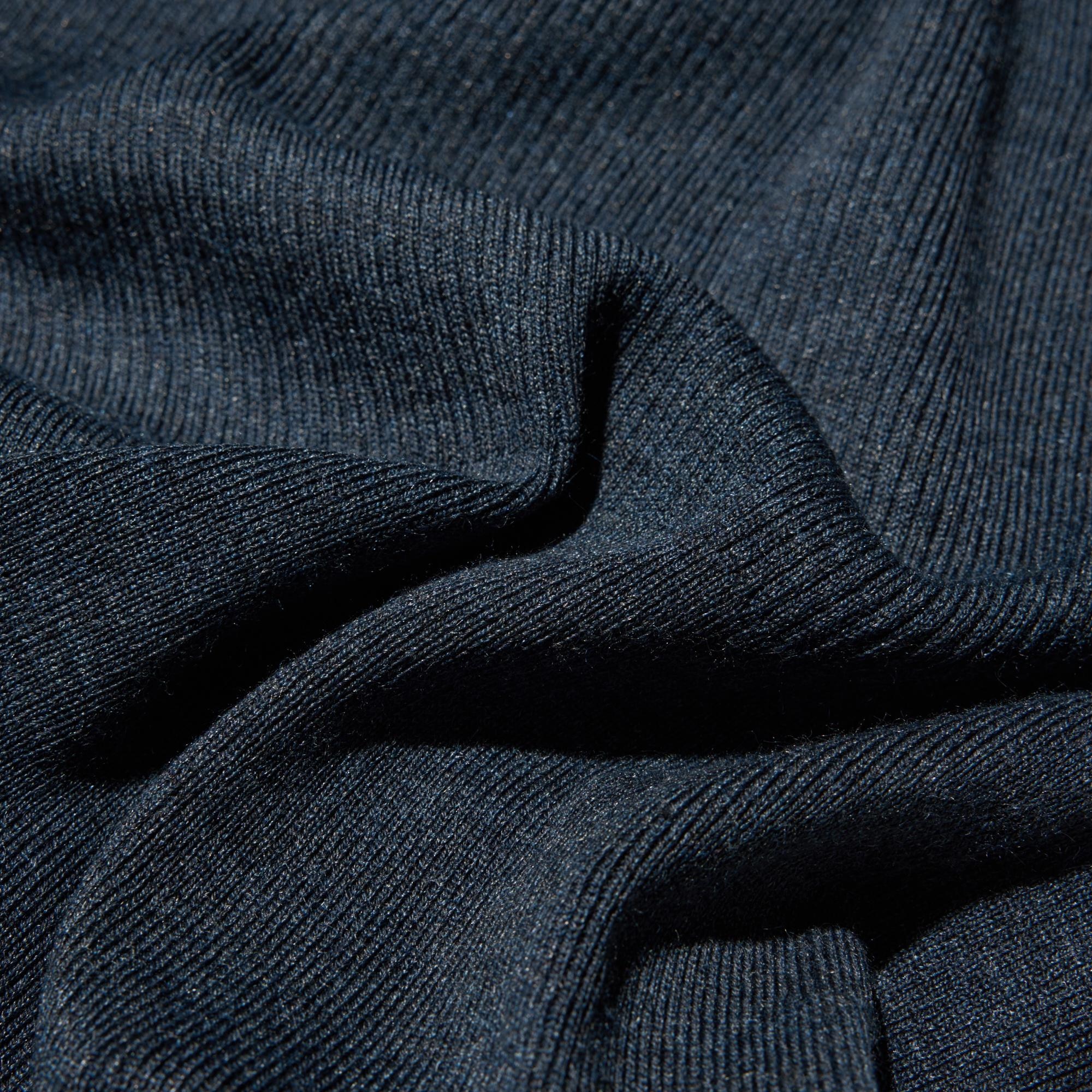 3D ribbed knit in a premium merino blend with distinctive stitch variations. Long-sleeve mock neck dress.