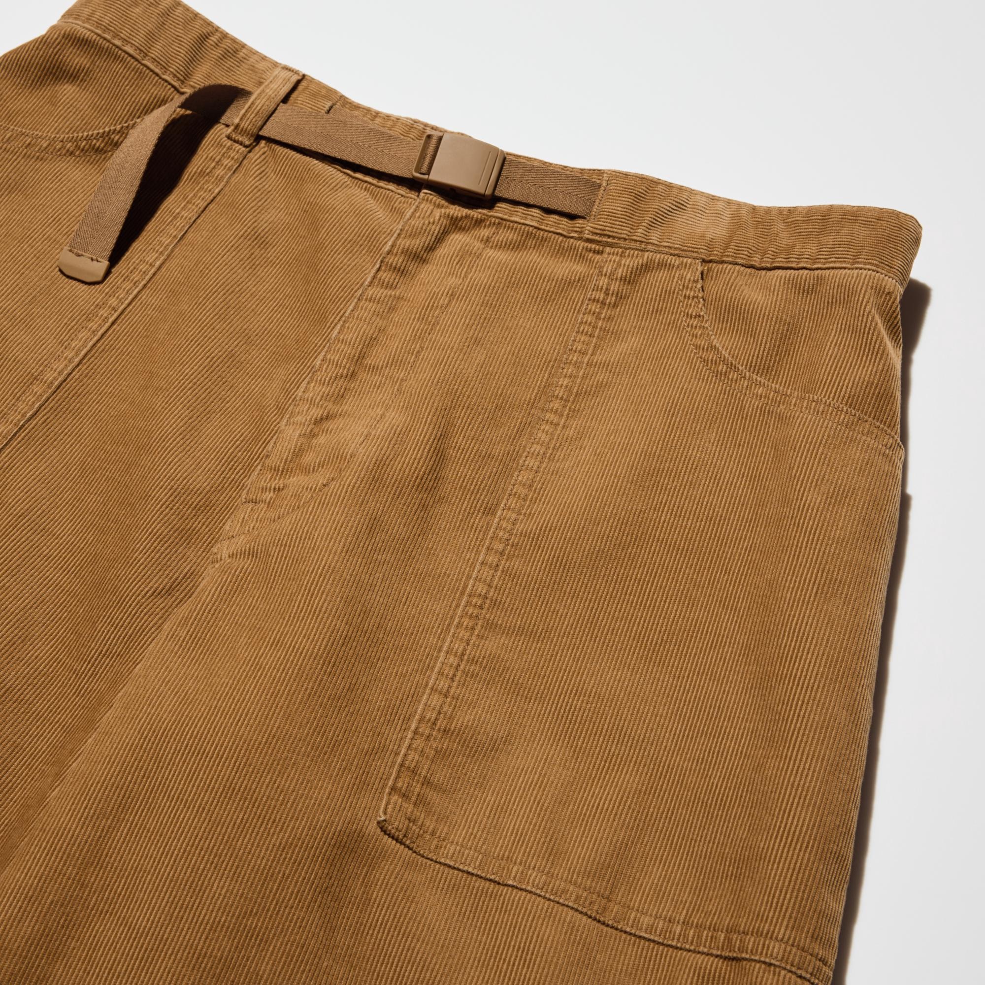 Workwear-style design with a baker-style front patch pocket. Easily adjustable buckle belt design at the waist.