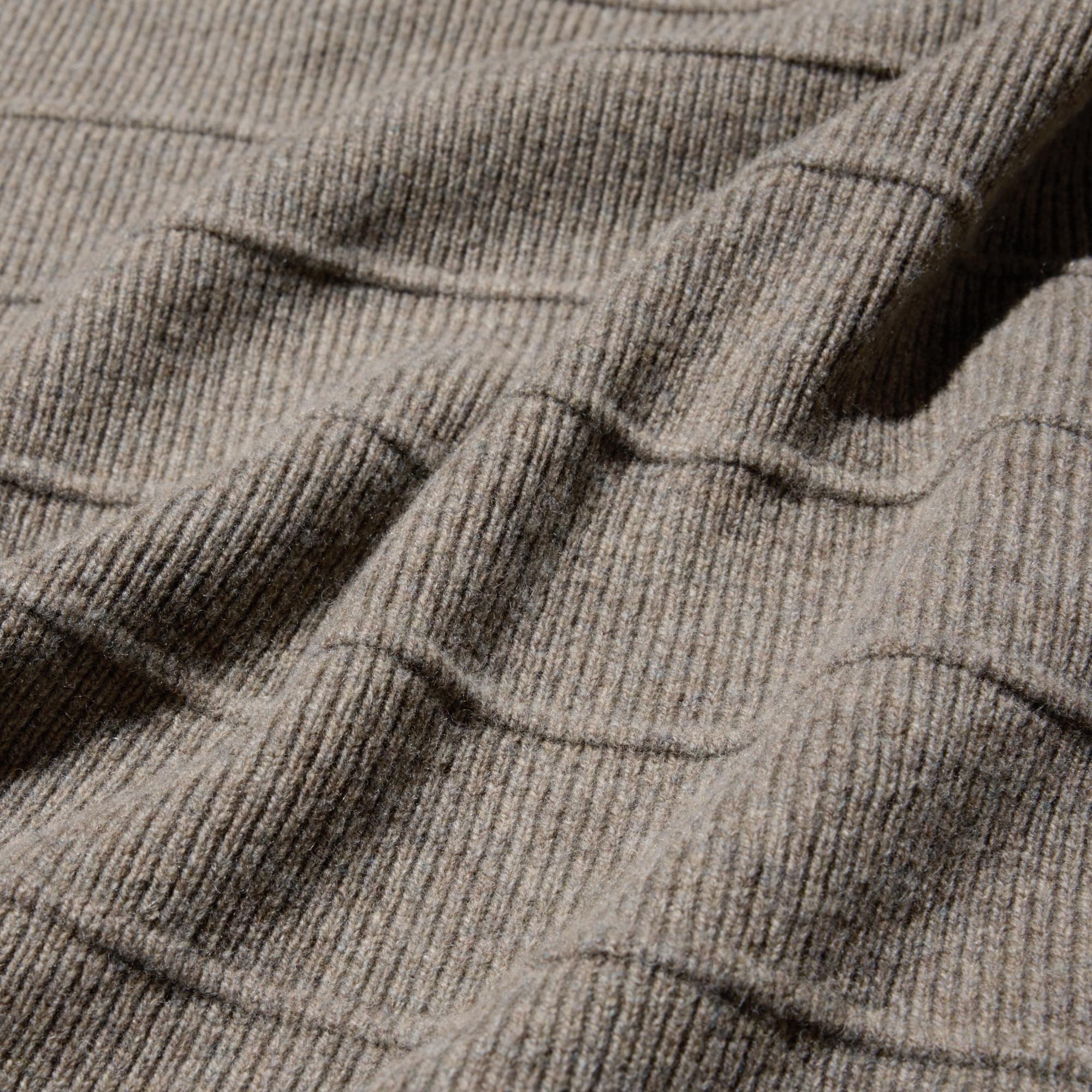 Premium wool, tightly twisted for softness and warmth. Mid-gauge ribbed knit creates a striped effect. Hand-washable.