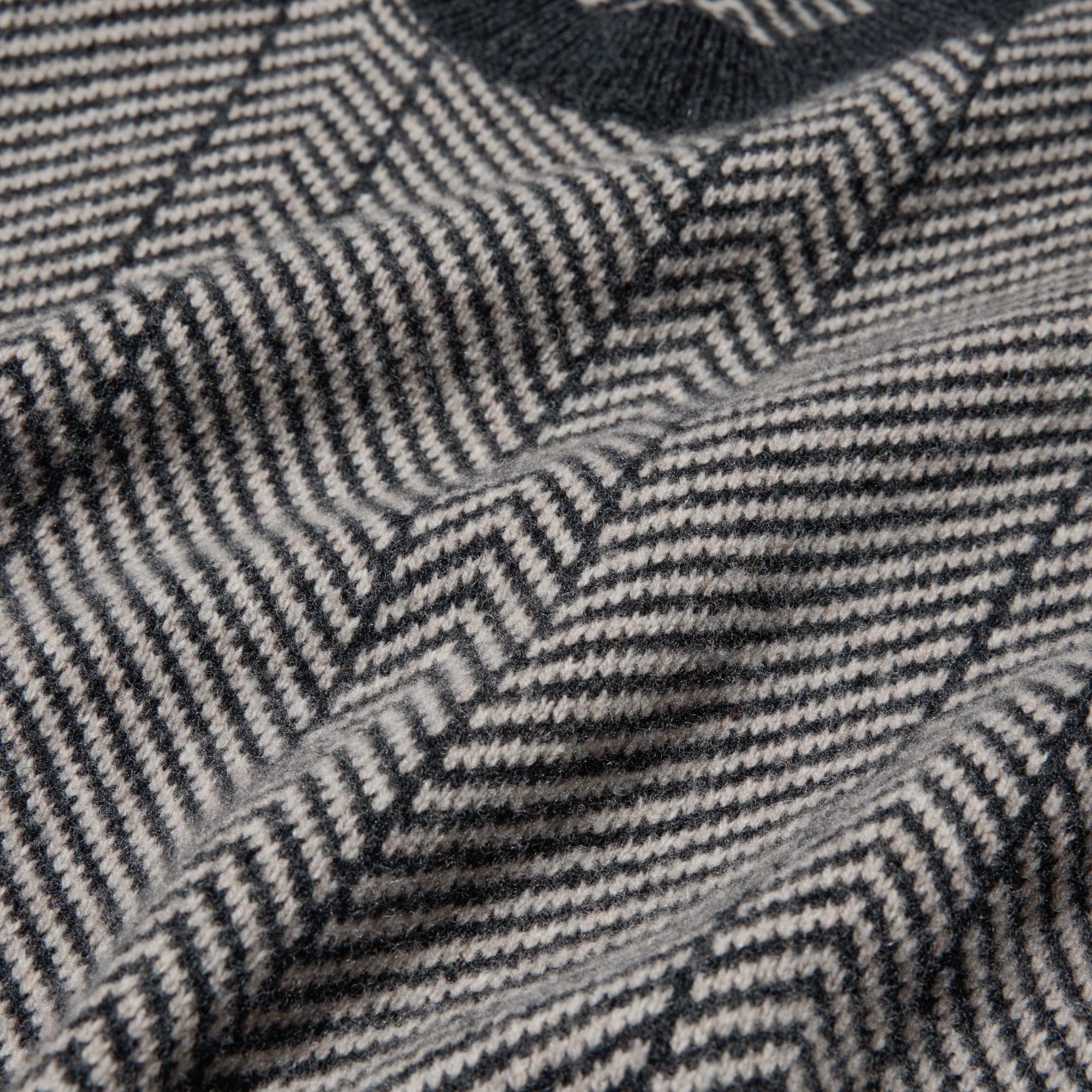 Distinctive two-tone herringbone pattern. 100% wool with a casual feel. Hand-washable.