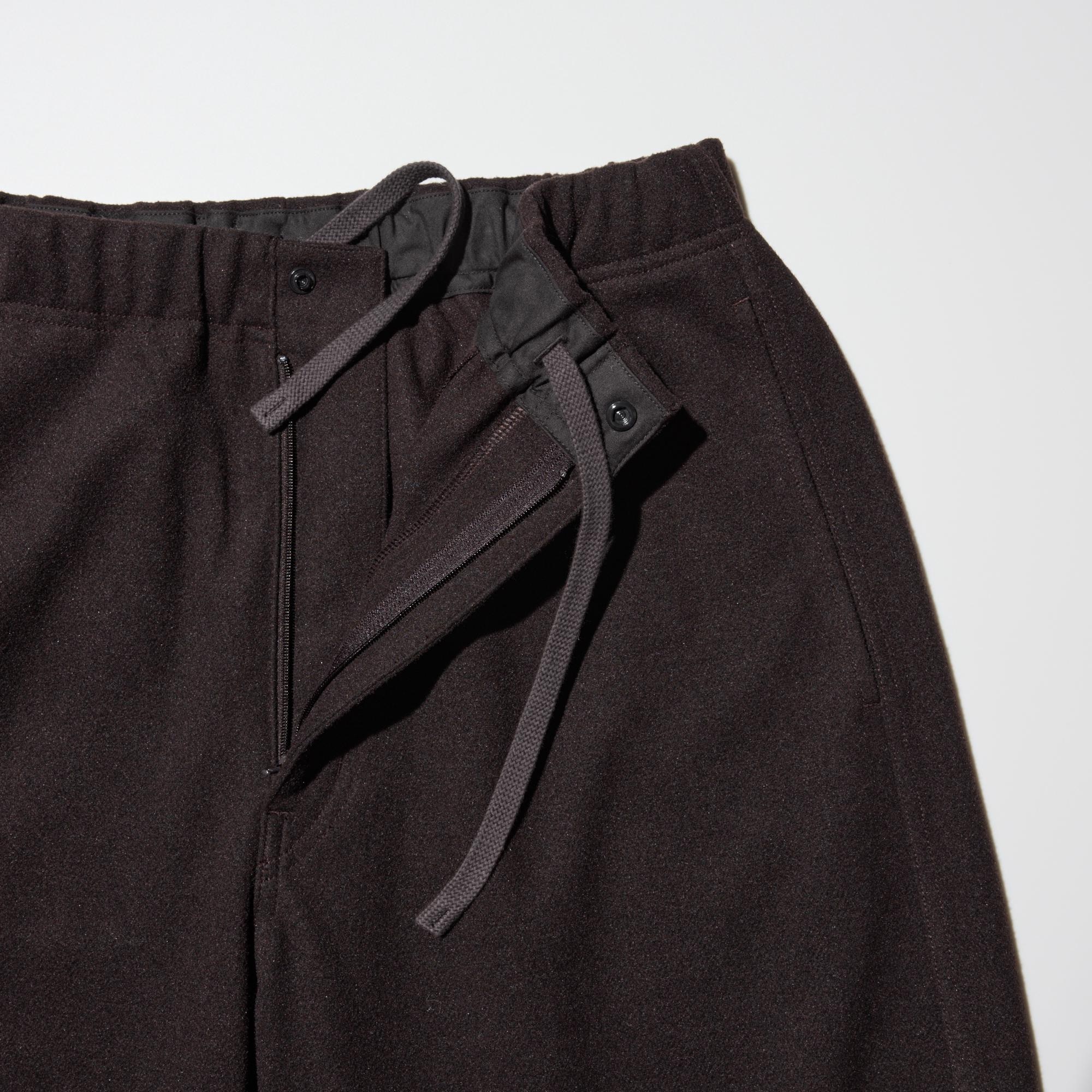 Elastic waist with drawstring for size adjustment. Front-opening design.