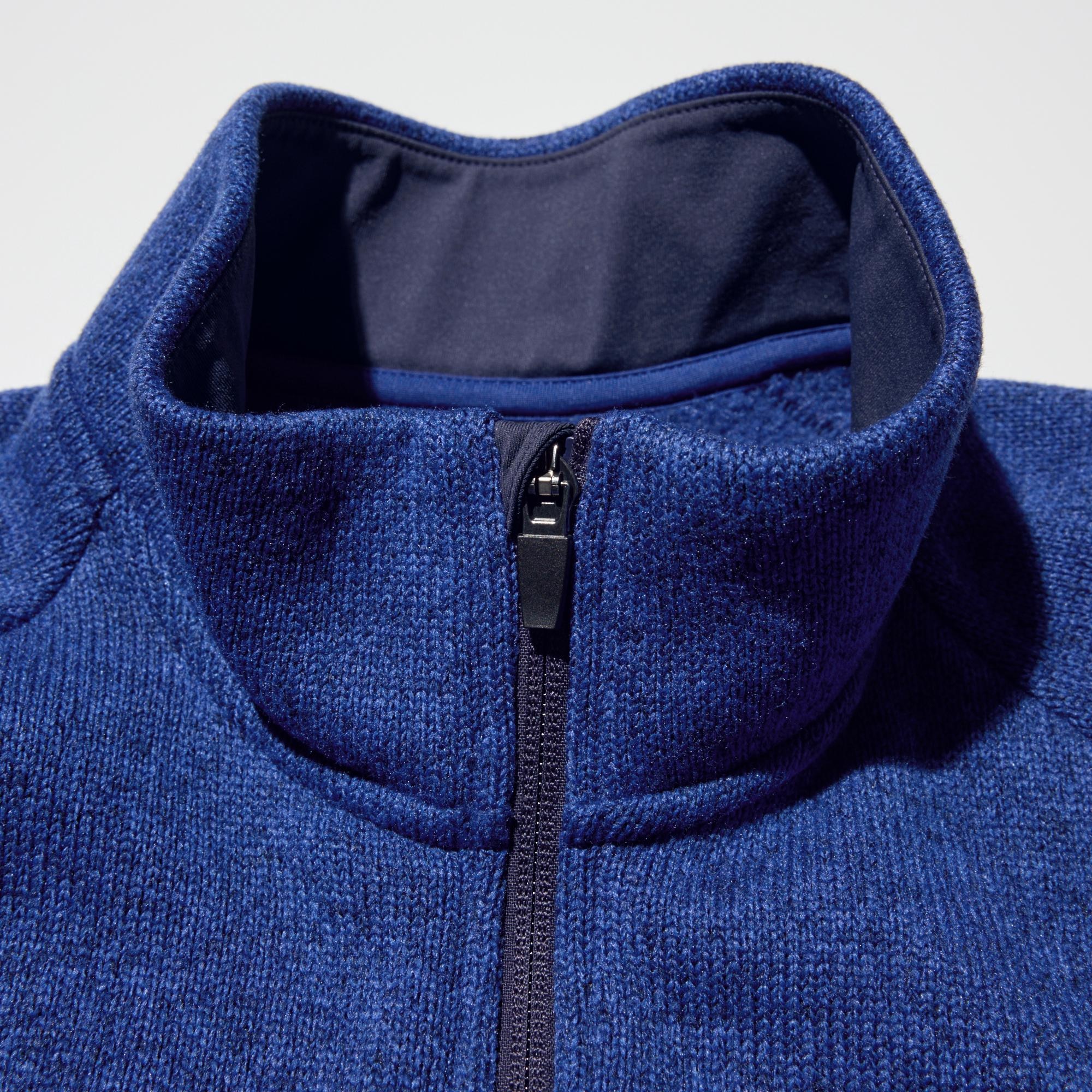 Chin guard at the top of the placket.