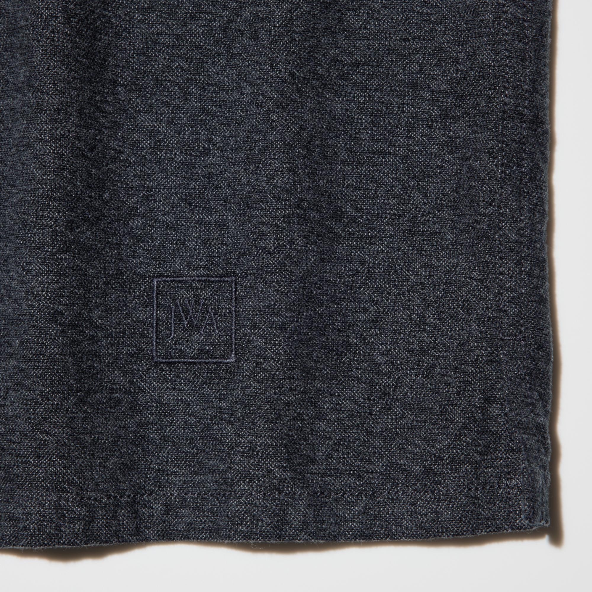 Tonal JWA logo embroidered on the left front hem.