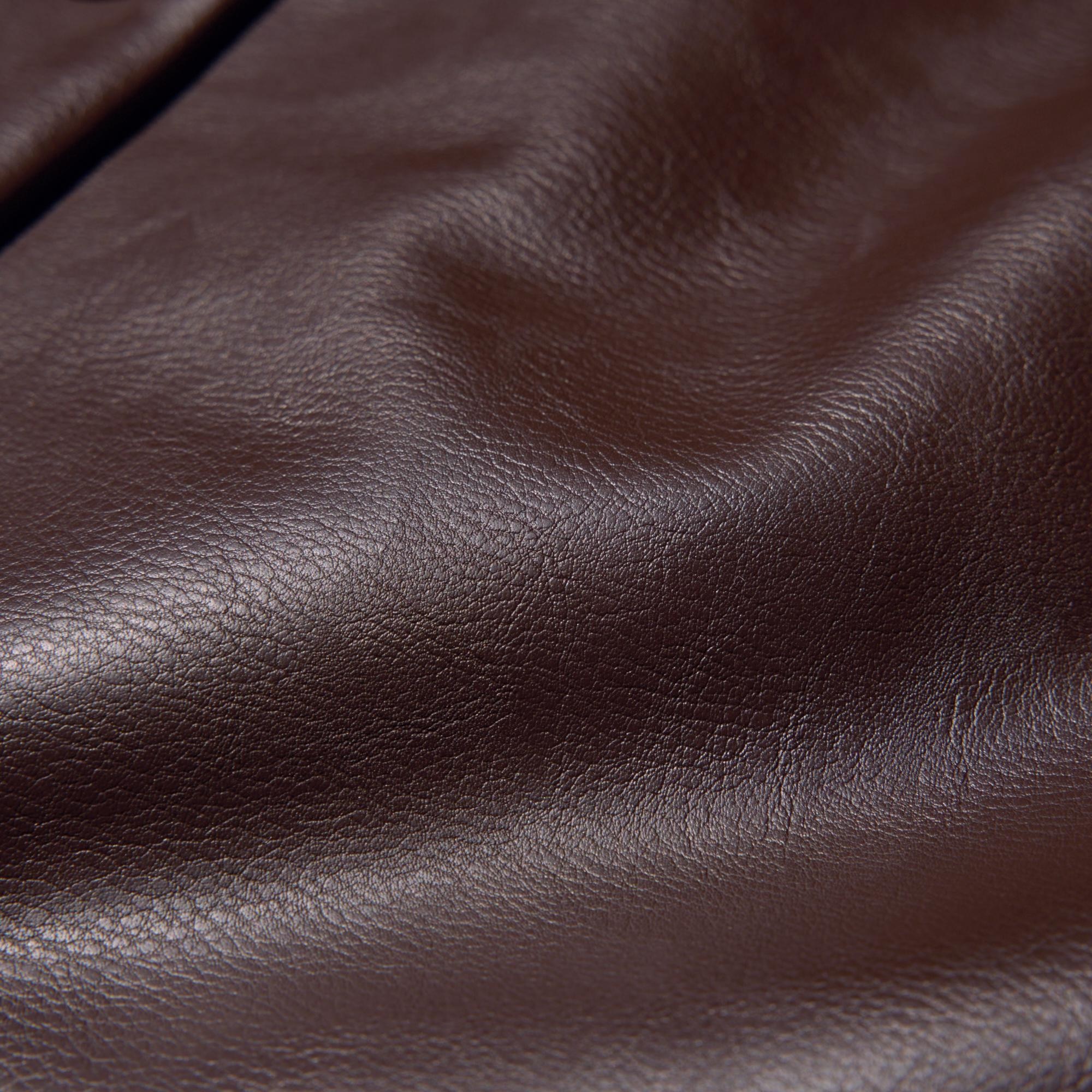 The fabric is soft with a matte appearance that looks like real leather.