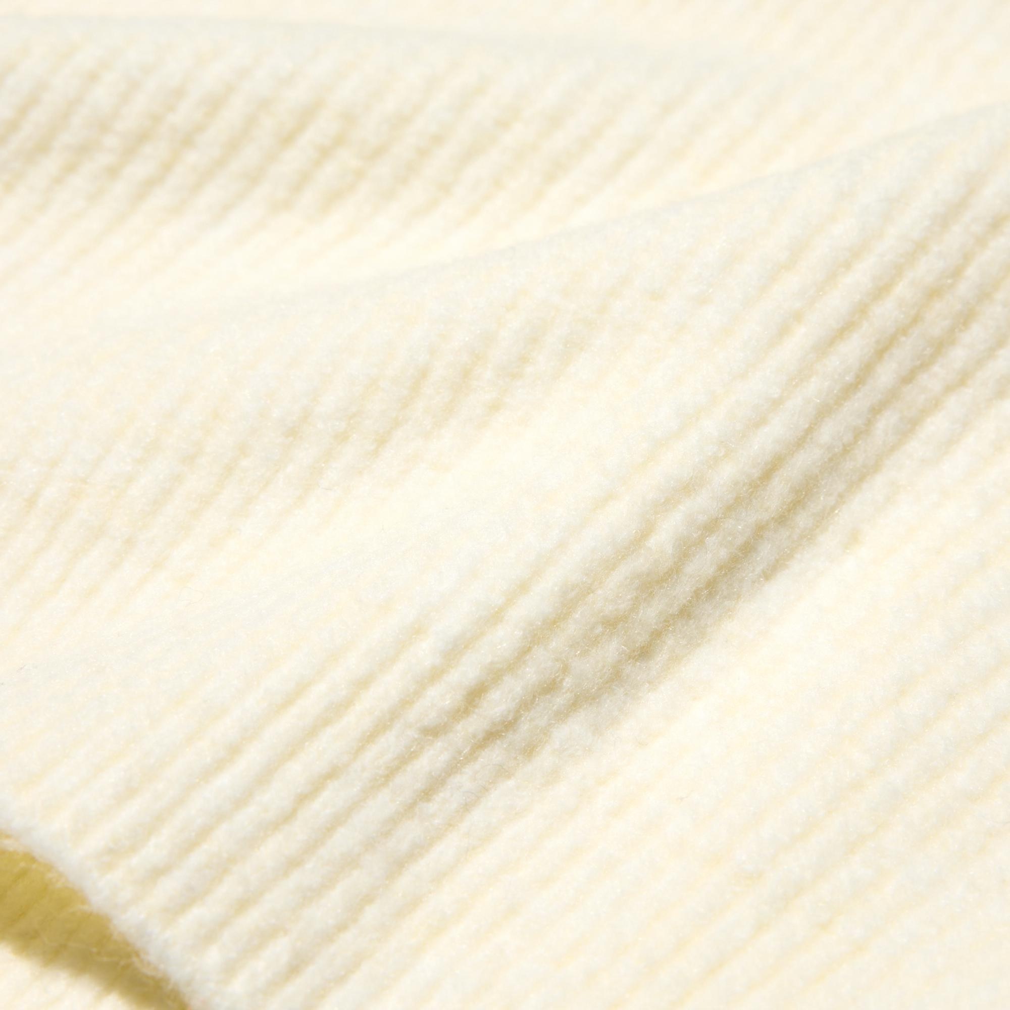 Lightweight, non-itchy 'Souffle Yarn' is specially brushed for extra warmth and softness.