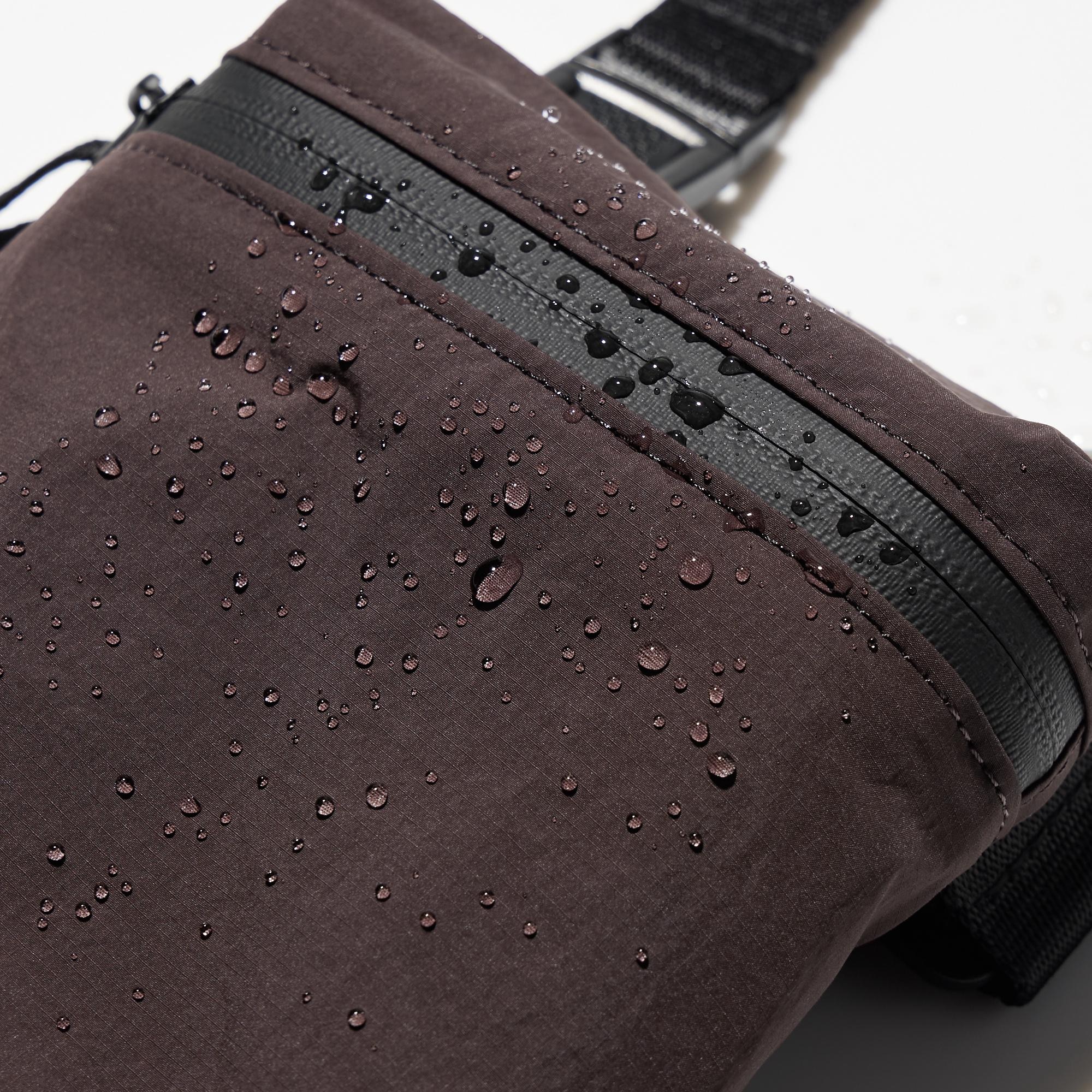 Water resistant fastener. Lightweight nylon fabric. Water-repellent finish protects against light rain. *The finish is not permanent.