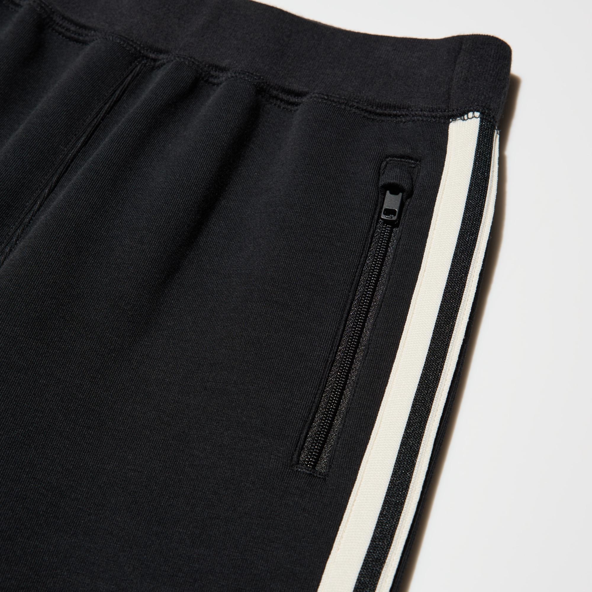 Pockets with slide fasteners keep belongings safe.