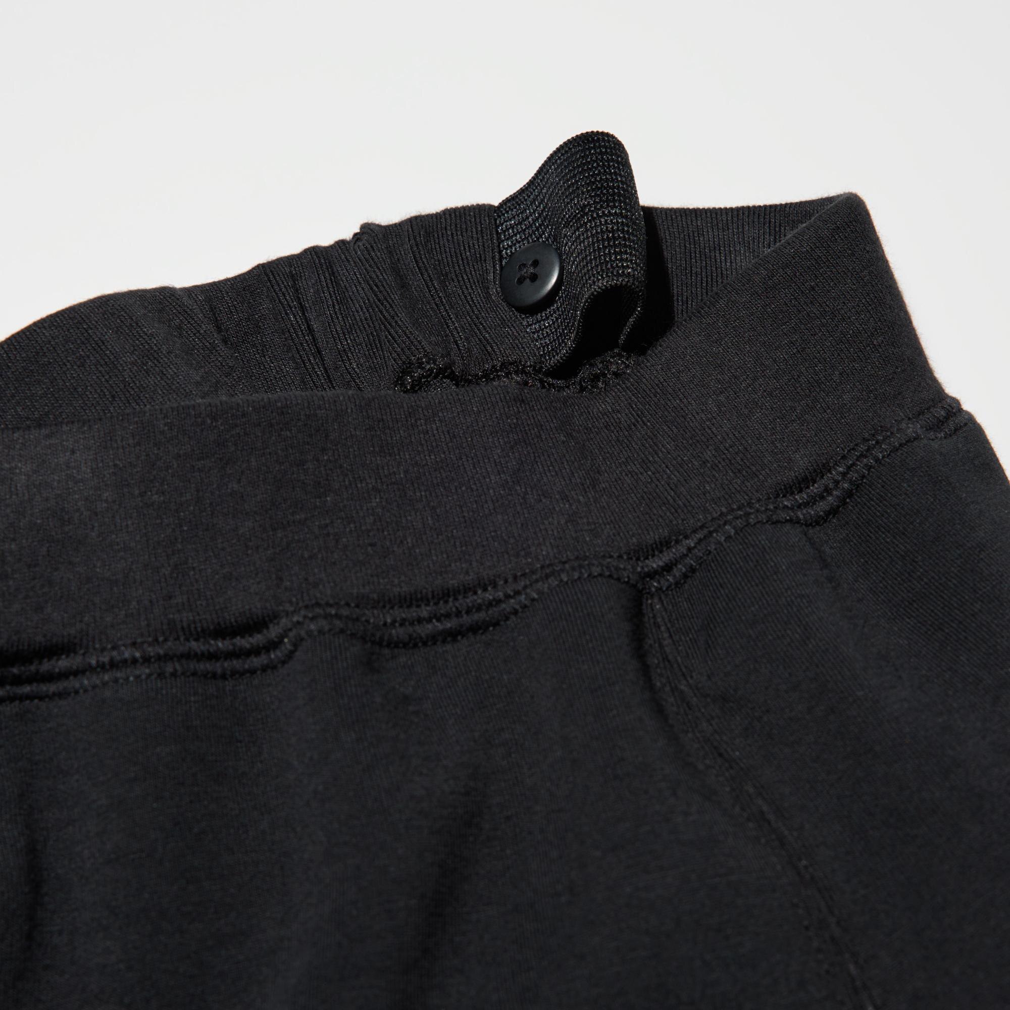 To adjust the fit, pull the elastic waistband through the opening and button at the desired location.