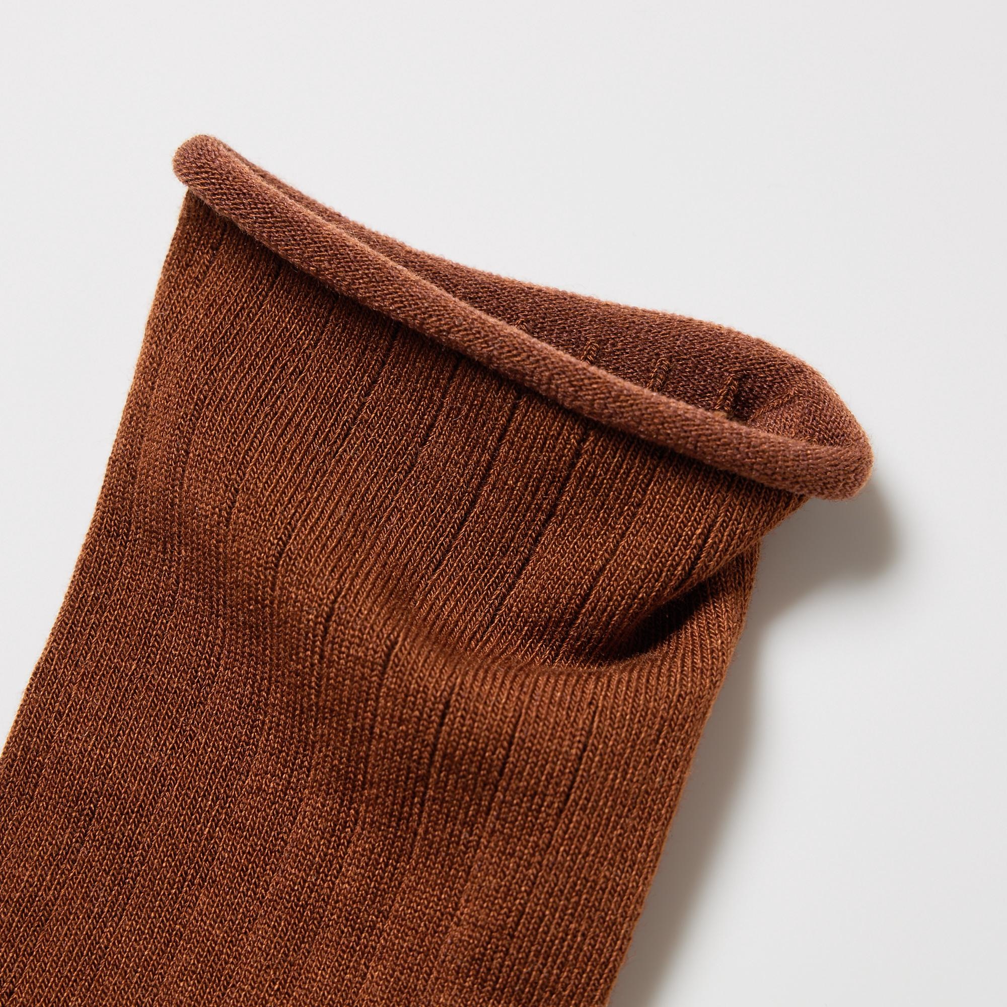 Roomy design at the ankle for a comfortable, non-restrictive fit. Thick ribbed knit with a roll top design at the ankle for a comfortable fit.