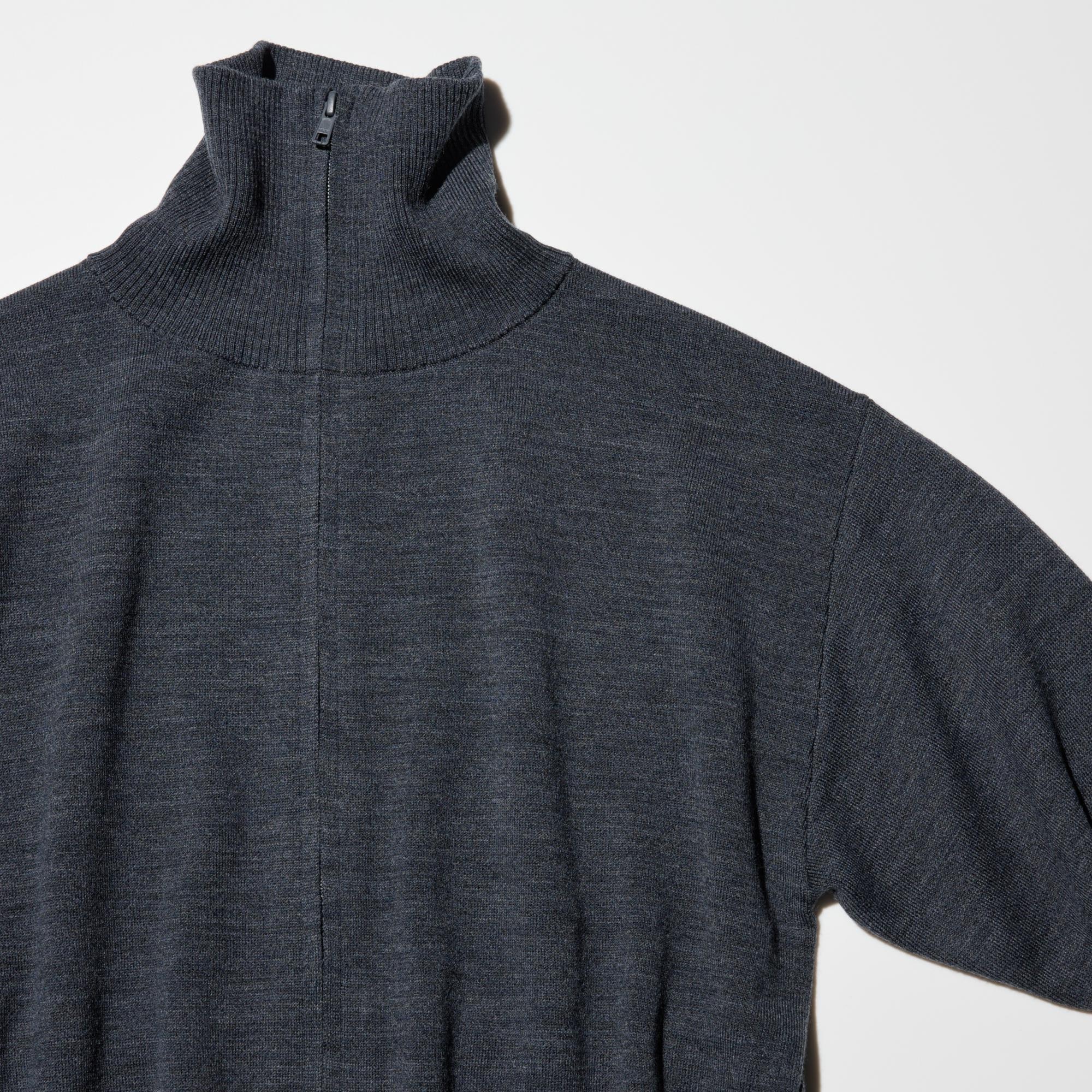 High neck cardigan with slightly dropped shoulders and a regular fit. With hidden slide fastener.