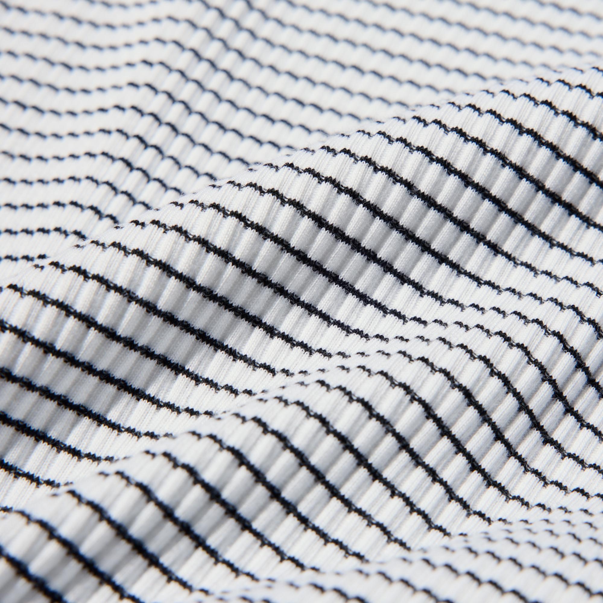 Moderately thick ribbed fabric with a premium texture.