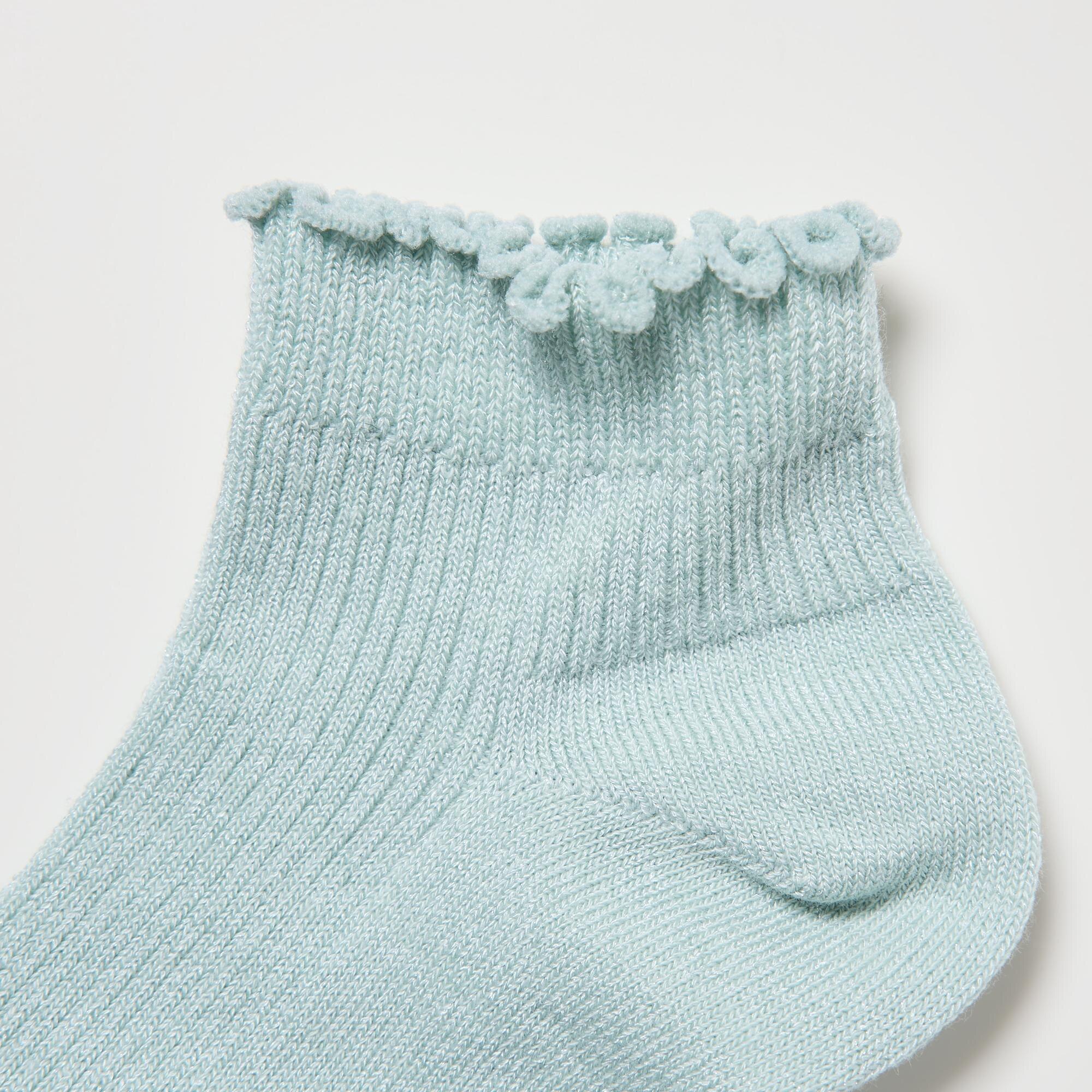 Frilly lettuce-edge finish at the leg opening.