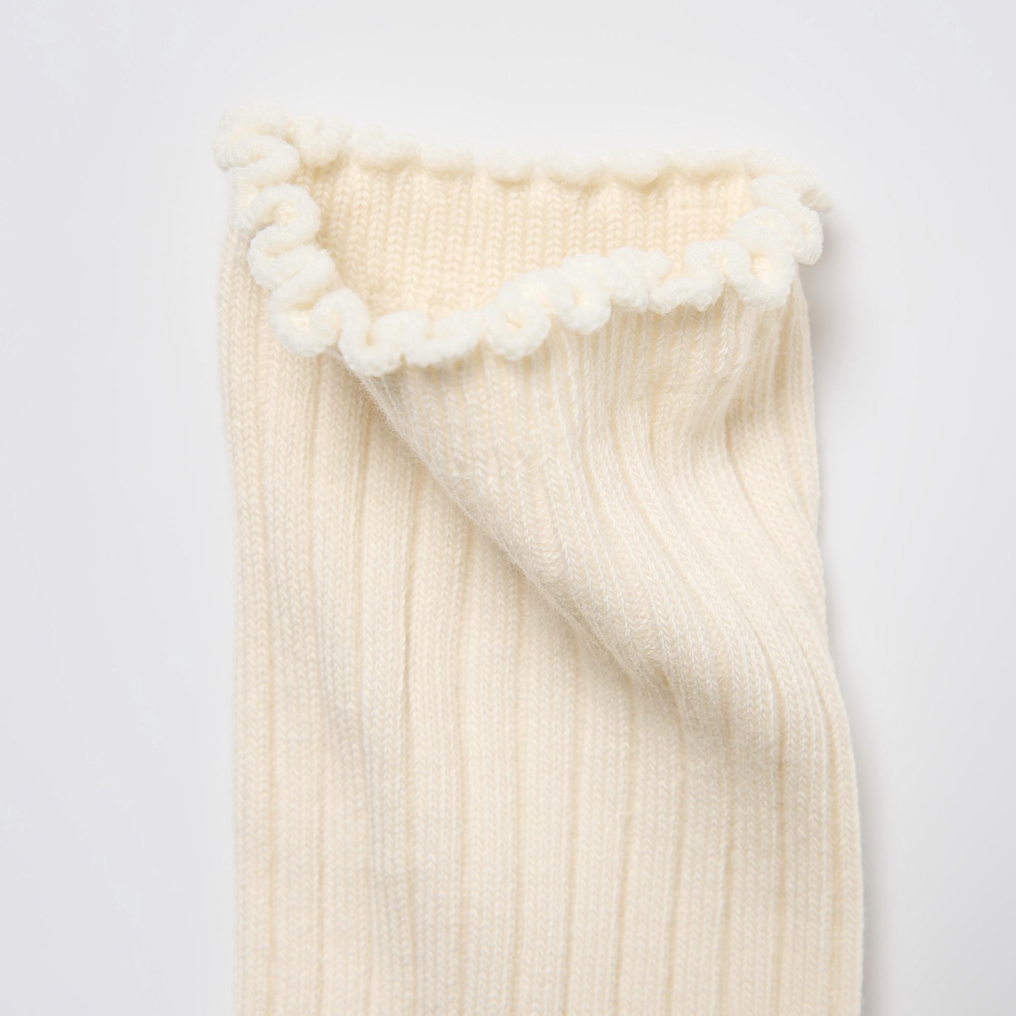 Soft, frilled edge at the ankle.