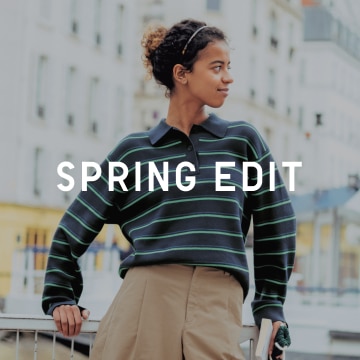 Spring Edit text over a model wearing a striped navy long sleeve polo shirt