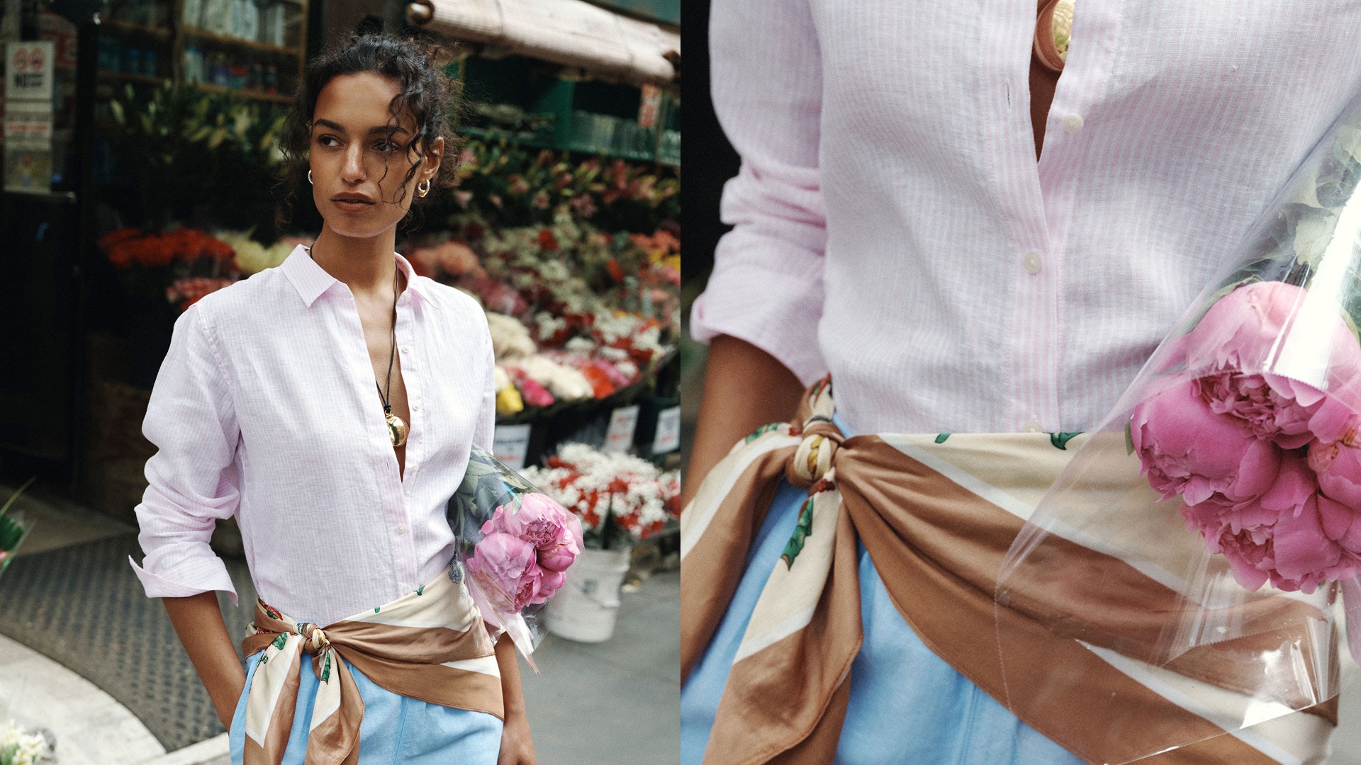 woman on the sidewalk outside a flower shop. Holding a bouquet of pink carnations. Wearing a pink long sleeve striped premium linen shirt, blue linen shorts, and tied silk scarf on the waist.