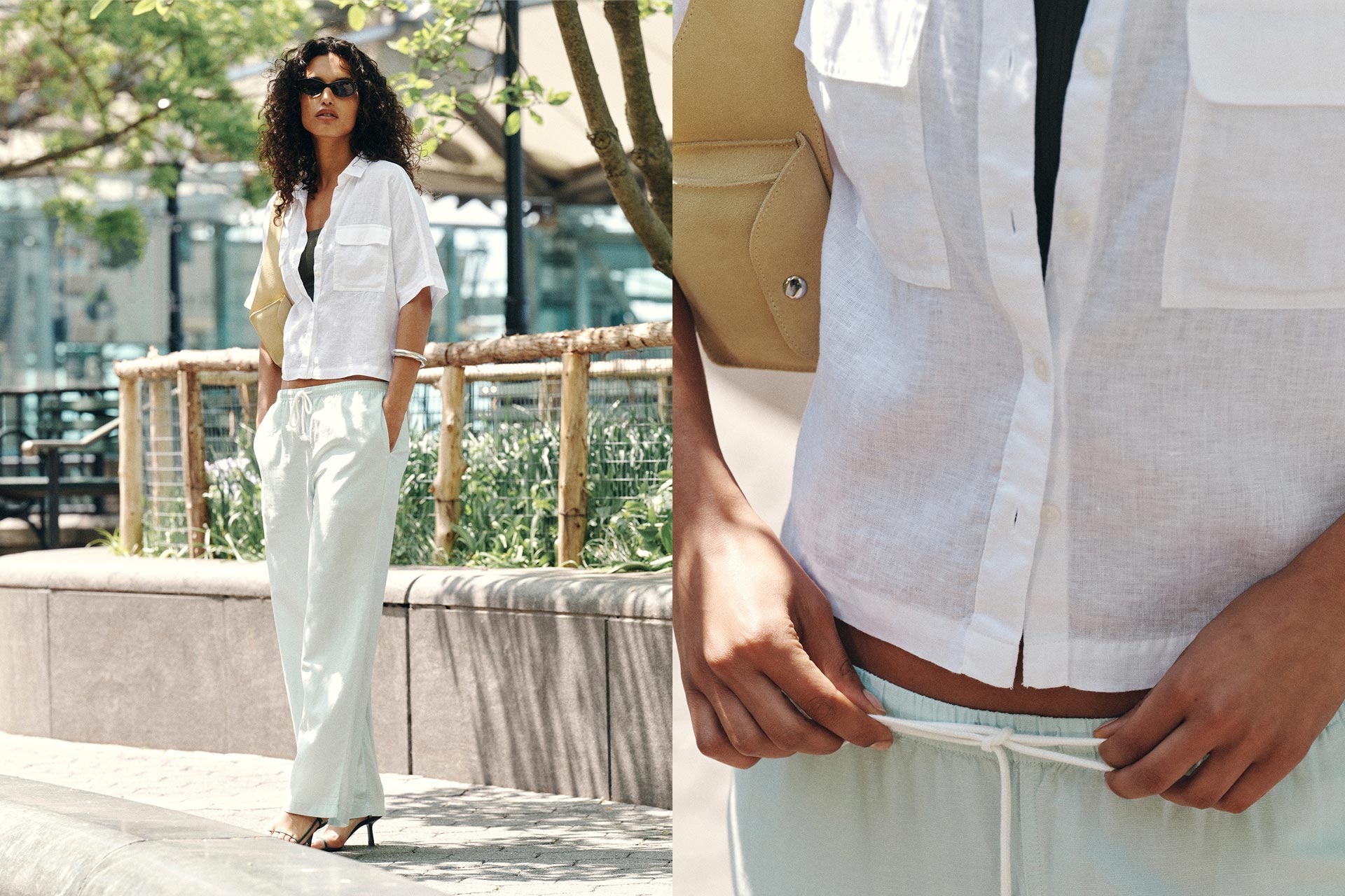 Woman standing on a sidewalk wearing white short sleeve linen shirt with breast pocket. Her hands are in the pockets of matching white linen easy pants with white string.