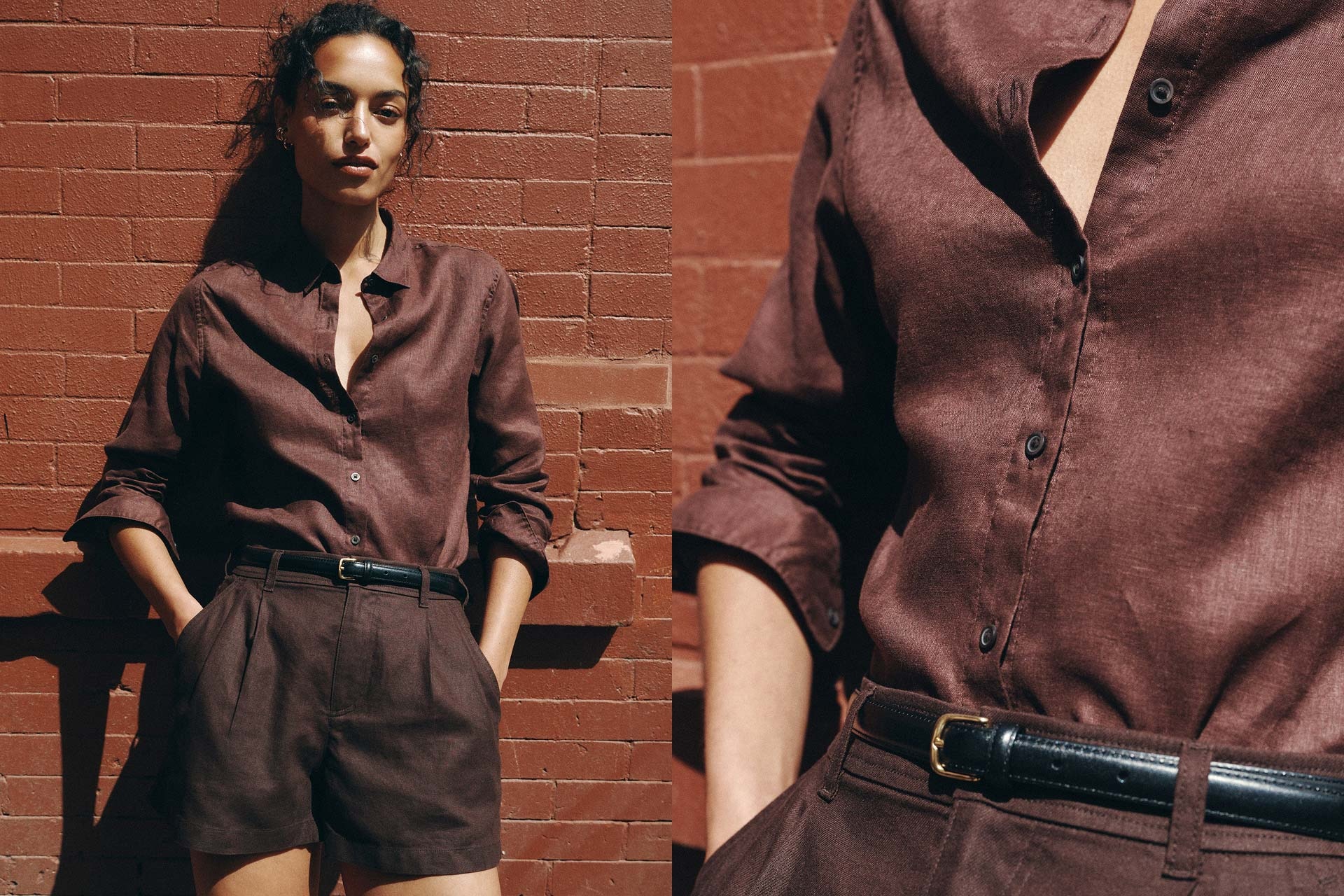 Woman resting against a red brick wall. Wearing a brown long sleeve premium linen shirt, thin black belt, and a slightly darker brown linen short