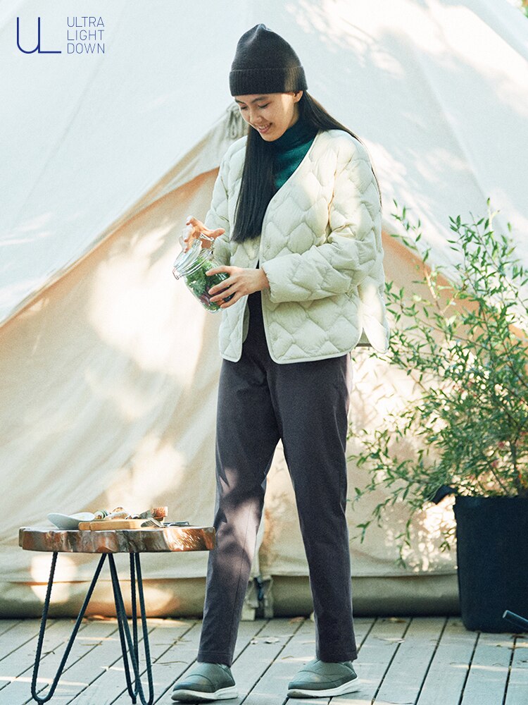 This down jacket features diamond quilting and side slits for a sleek look.