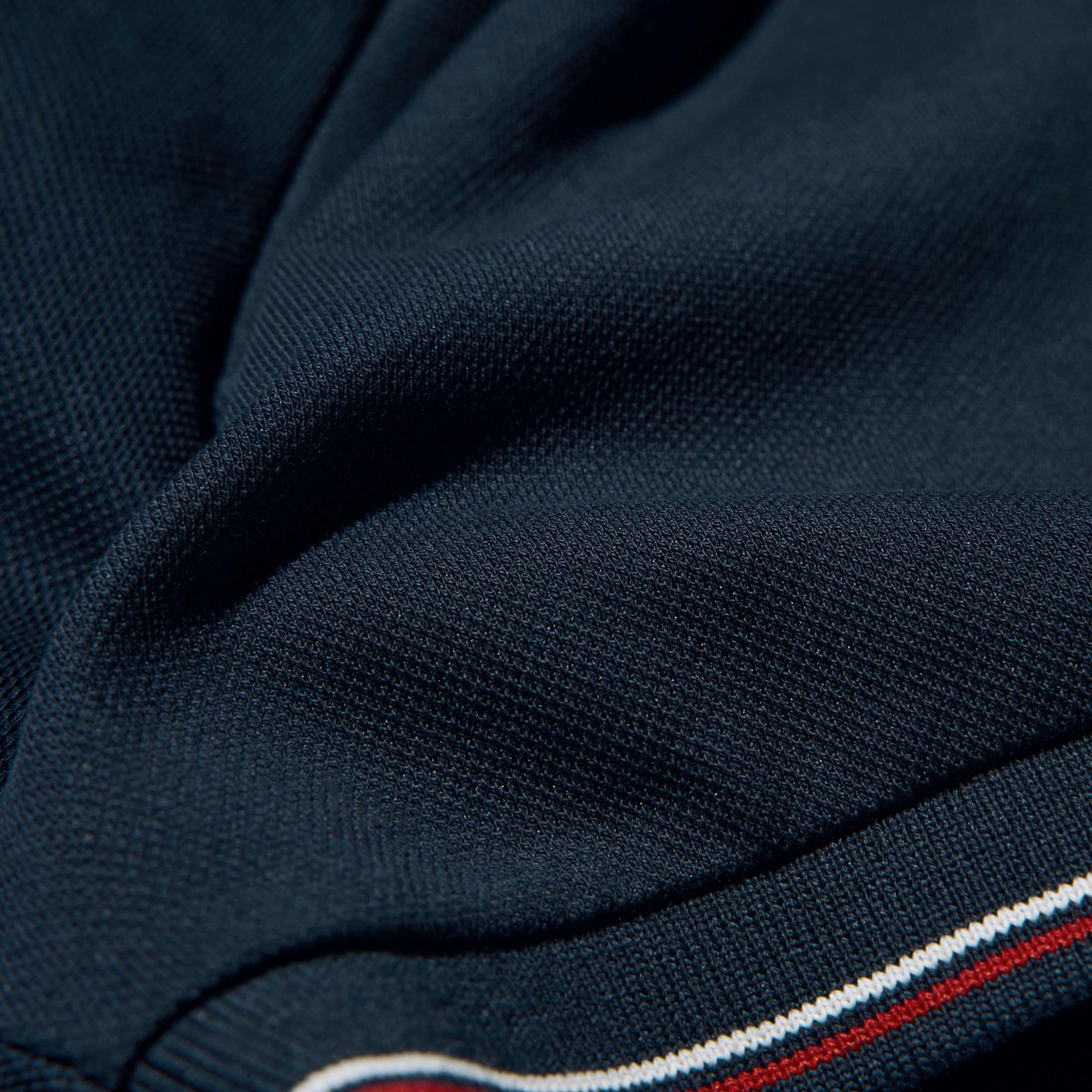 Smooth, light pique fabric made from a blend of pilling-resistant cotton and polyester.